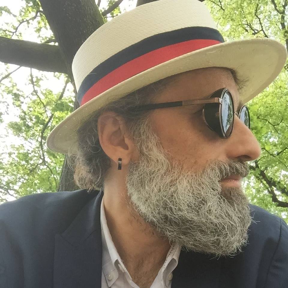 Savić Rašović outdoors wearing a hat and sunglasses