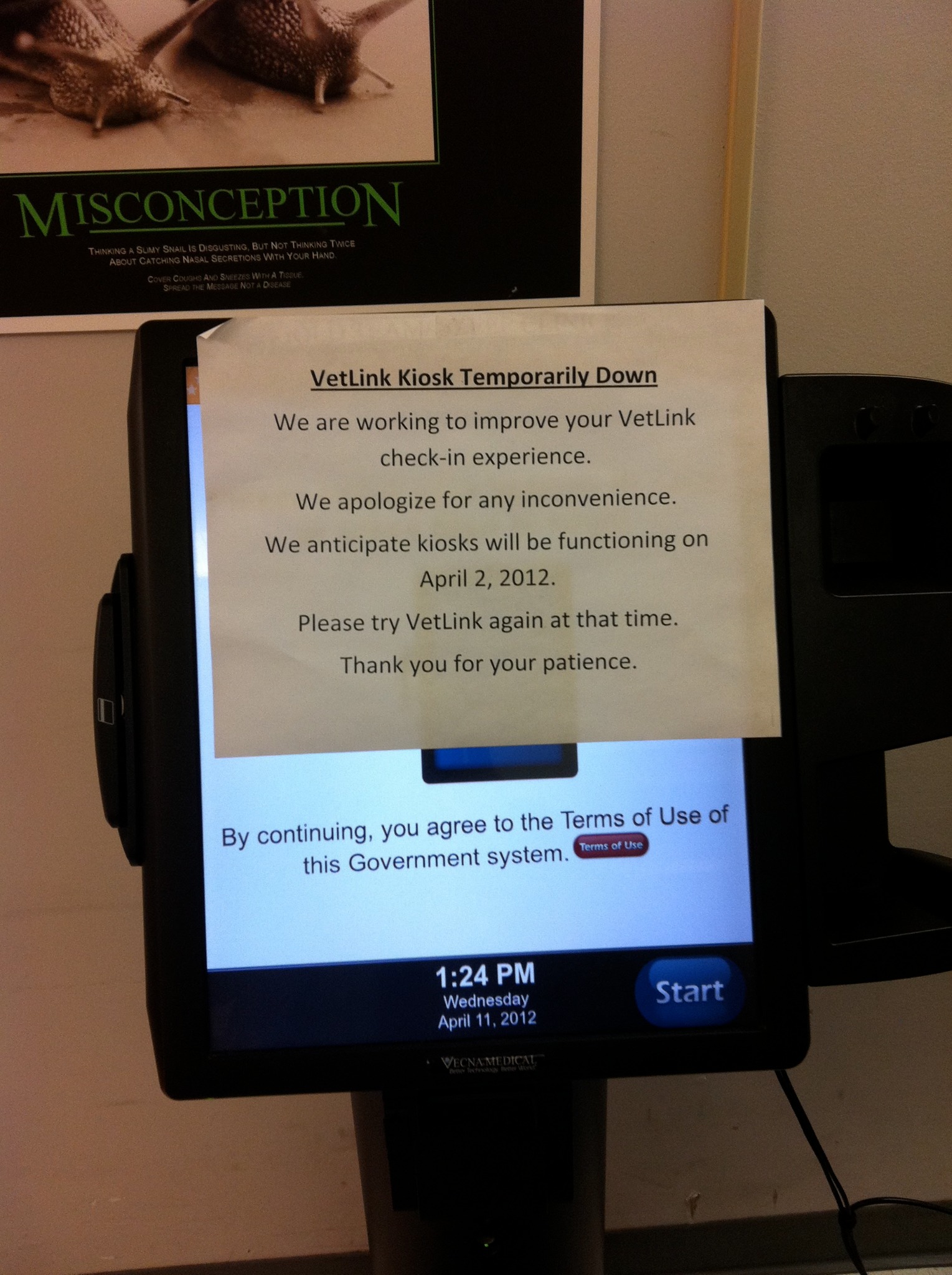 A VetLink kiosk covered by a paper notice saying it is temporarily down